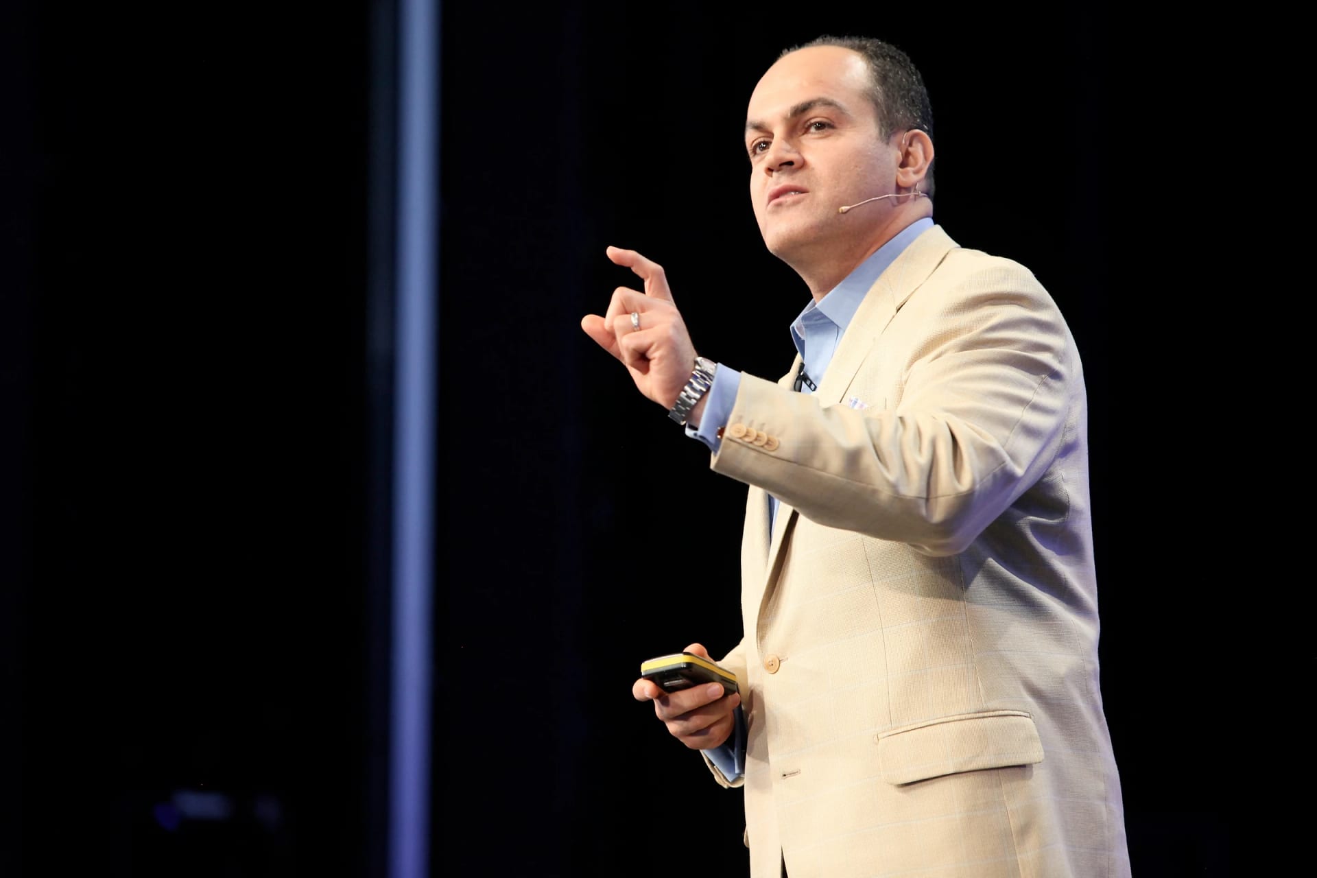 David Nour delivering a keynote on stage